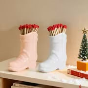 Boot matchstick holder